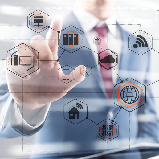 Business man standing in front of a screen with business icons