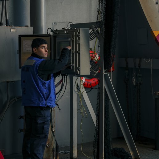 Elevator technician working on a marine elevator.