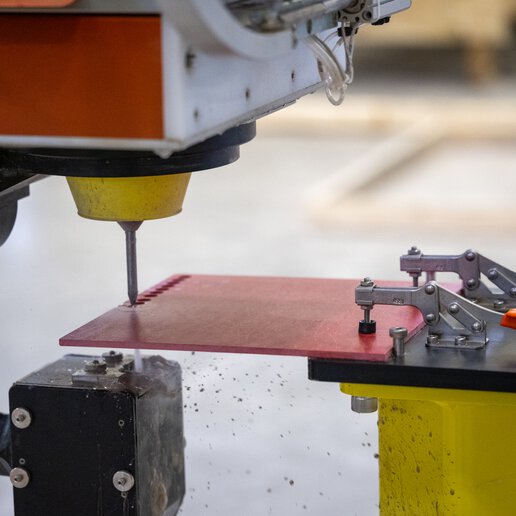 Waterjet cutting machine cutting a sample coupon.