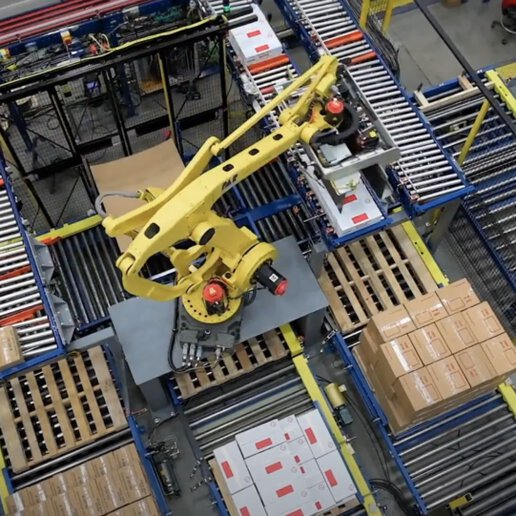 Fanuc robot placing boxes for palletizing.