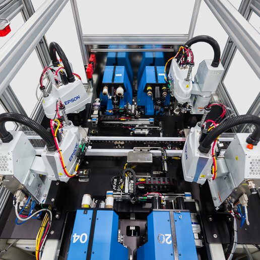 Top down view of PAR Systems robotic tube labeling system with white background.