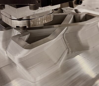 Friction Stir Deposition Tool Building a Layered Metal Component