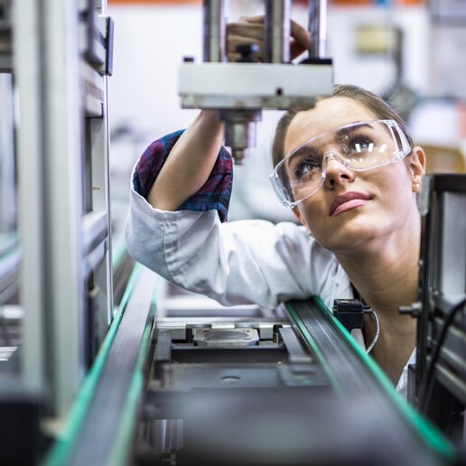 Quality control woman validating laboratory automation equipment