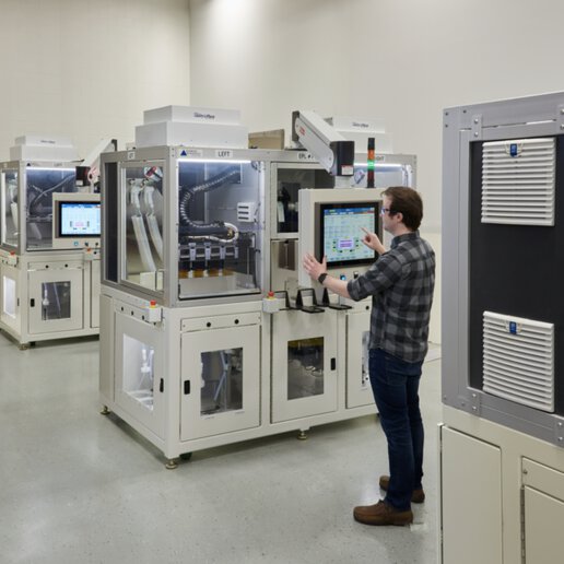 PAR Systems engineer using screen to digitally manipulate automated robotic system.