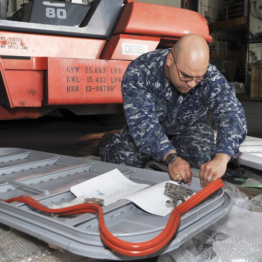 Engineer working on the seal of a marine door.
