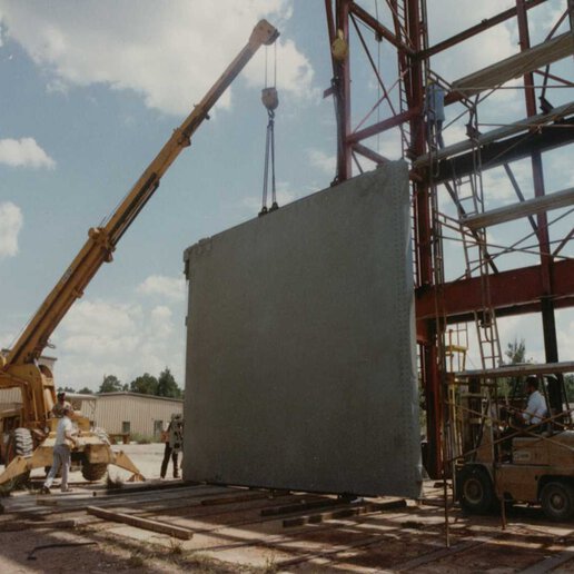 Jered aircraft hangar access door being lifted from a crane.