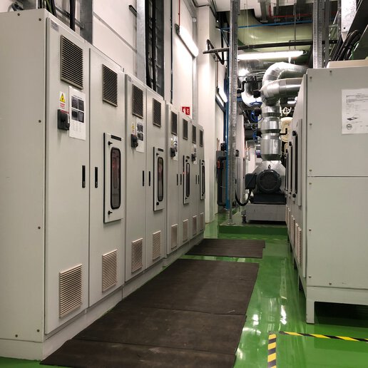 Rows of electrical panels on ship.
