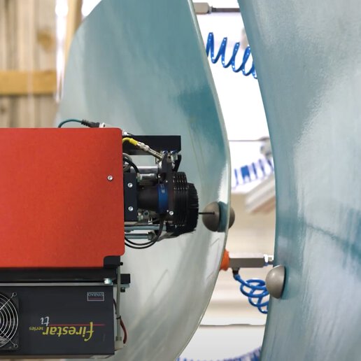 Configurable, robotic fixture conducting laser scrubbing of a composite component.